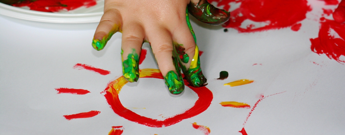photo of child's hand fingerpainting