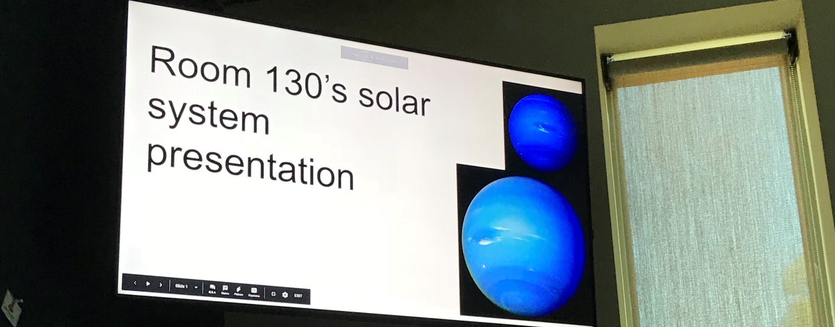 A student presenting their solar system presentation