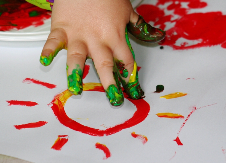 photo of child's hand fingerpainting