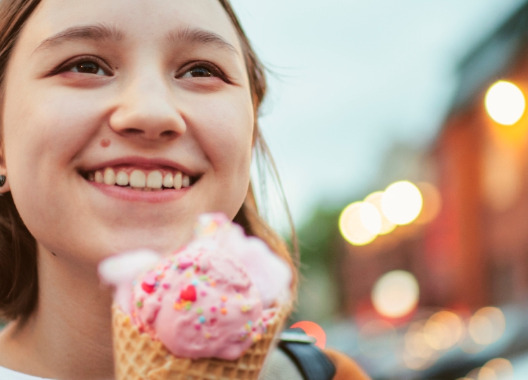 Teen girl holding ice cream cone