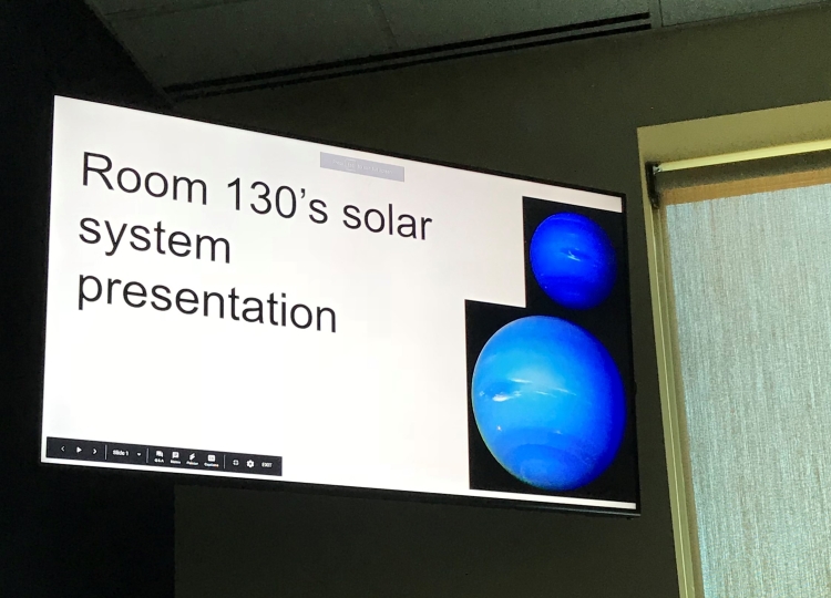 A student presenting their solar system presentation