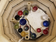 TDS Hand-made mugs in the kiln